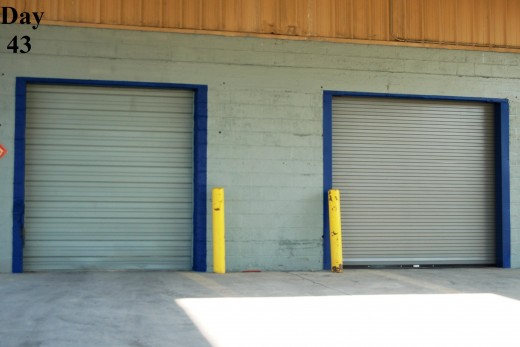 I experienced another painfully slow day at work, so I painted the trim of our warehouse doors blue.  It took longer than I wanted it to and, sadly, it's going to need another coat :-(