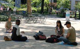 New Yorkers meditating in Madison Square Park.