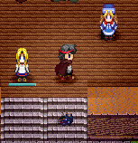 My character with red bandanna. Female companion to the left and a shopkeeper to the right. Garbage under me :(.