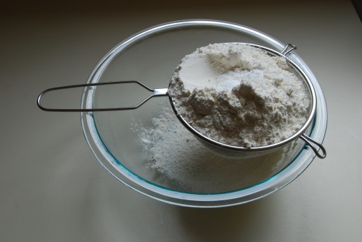 Sifting the flour and cream of tartar