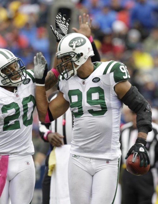 New York Jets' Jason Taylor celebrates his fumble recovery with Kyle Wilson (20) during the second half of the NFL football game against the Buffalo Bills in Orchard Park, N.Y., Sunday, Oct. 3, 2010. The Jets won 38-14. (AP Photo/David Duprey)