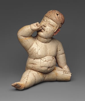 Here is another action figurine carved by an ancient Olmec artist. There are a large number of such carvings in many materials.