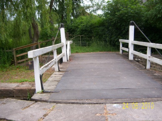 Swing bridge leading to a private house and land