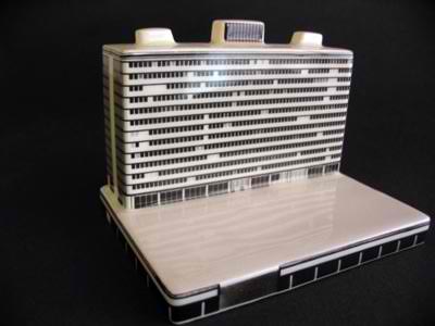 Miniature building on laptop computer