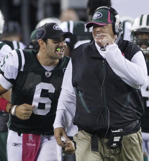 New York Jets quarterback Mark Sanchez, left, and coach Rex Ryan celebrate after the Jets scored late in the fourth quarter of an NFL football game against the Minnesota Vikings early Tuesday, Oct. 12, 2010, in East Rutherford, N.J. The Jets won 29-2