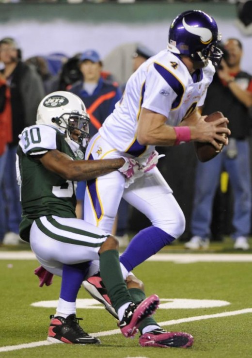 Minnesota Vikings quarterback Brett Favre is sacked by New York Jets' Drew Coleman during the first quarter of an NFL football game Monday, Oct. 11, 2010, in East Rutherford, N.J. (AP Photo/Bill Kostroun)