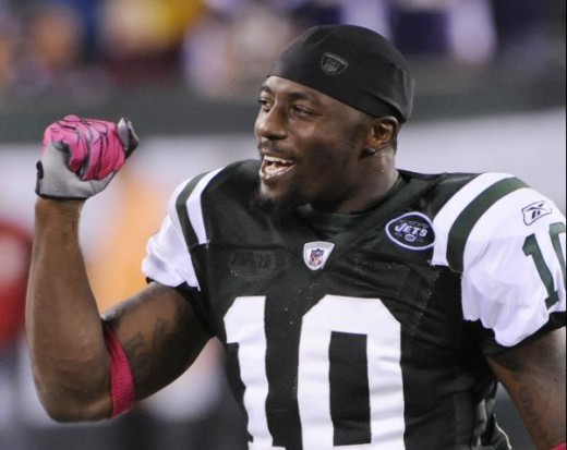 New York Jets' Santonio Holmes celebrates after the Jets beat the Minnesota Vikings in an NFL football game Monday, Oct. 11, 2010, in East Rutherford, N.J. The Jets won the game 29-20. (AP Photo/Bill Kostroun)