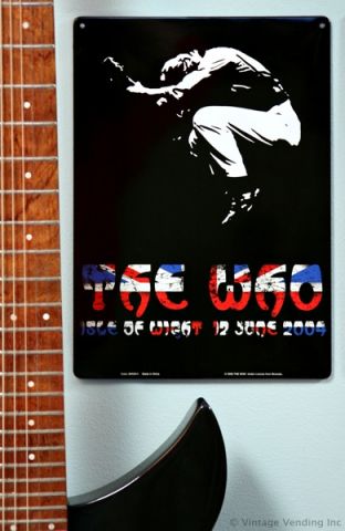 Cool way to display your guitar with a tin sign