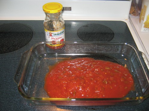 Dump the 16oz jar of salsa in the  baking pan.