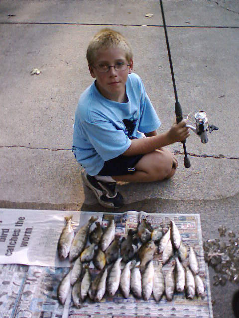 Proud to show the product of his day on the lake. 
