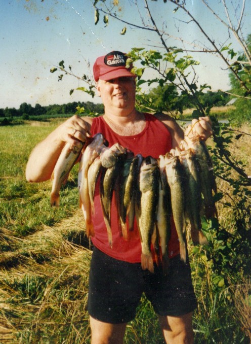 My good friend Rich is holding a nice stringer of farm pond bass. These fish were caught in  the late summer on chartreuse and white spinner baits.