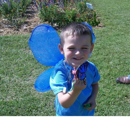 This young man enjoyed showing how his butterfly toy worked.  And he informed everyone that he liked being a BLUE butterfly.