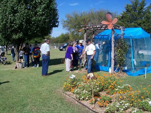Peeking into the butterfly holding tent. One of the nectar gardens is in in foreground.
