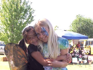 Emma Alexander and Jensen Bridges of Blanchard share a huge hug of happiness at the Monarch Festival.    Permission for photo by Kay Webb.
