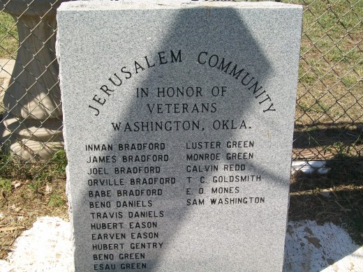 This granite Memorial Stone bears the names of many veterans who bore the same last name.  It stands at the entryway to the cemetery.