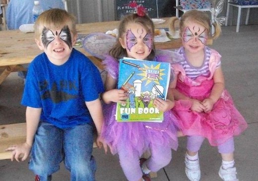 These three happy children shared their butterfly enjoyment with each other and the camera!