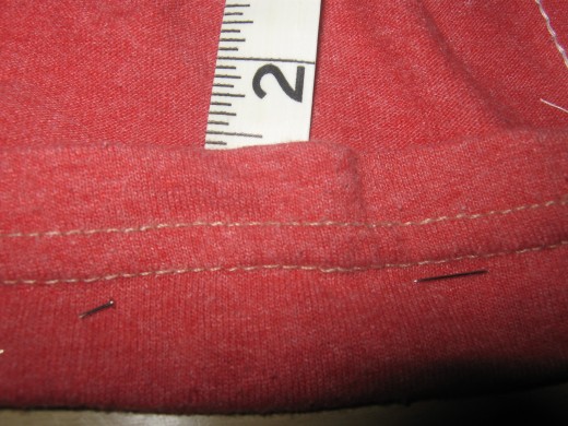 Use your tape measure and fold the material at the waist over. You want the pocket that doing this is making to measure 11/2 inches. Pin material in place. Do this until you have a waist band all the way around.