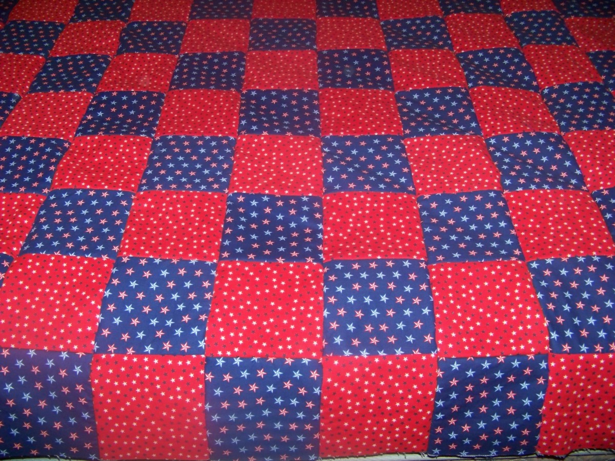 all rows sewed together with backing alternating red and blue material.