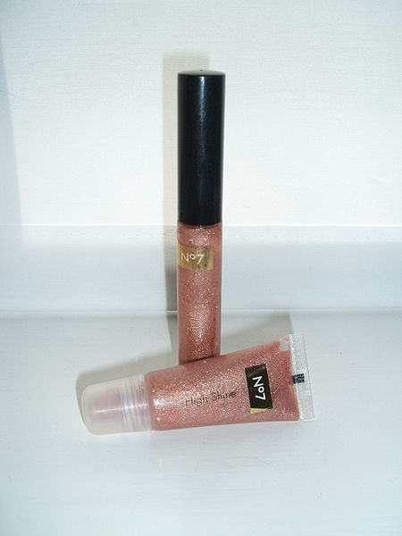 Lip gloss with a wand in a tube, or the little tube where you squeeze out lip gloss and apply.