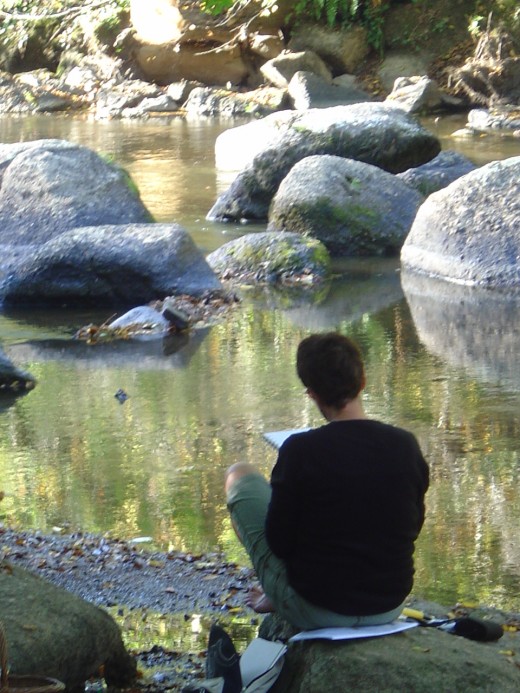 Student painting on the banks of the river Glane in St Junien