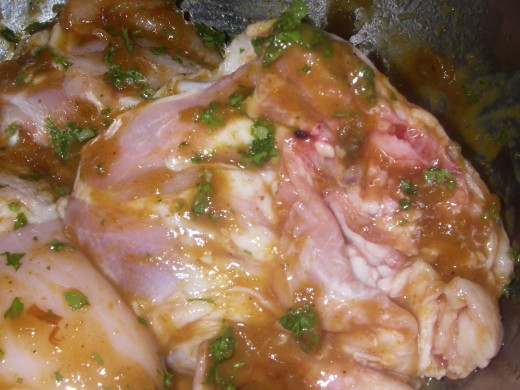 Rinse the chicken under cold running water, pat dry with paper towel. Rub the lime pickle over the chicken pieces and marinate for 30 minutes.