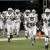 The New York Jets run out before the start of the first quarter of an NFL football game against the Detroit Lions at Ford Field in Detroit, Sunday, Nov. 7, 2010. (AP Photo/Carlos Osorio)