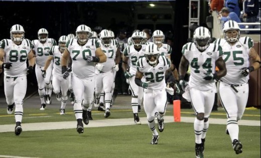 The New York Jets run out before the start of the first quarter of an NFL football game against the Detroit Lions at Ford Field in Detroit, Sunday, Nov. 7, 2010. (AP Photo/Carlos Osorio)