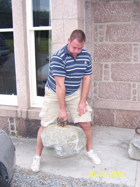 Not strictly kettlebell lifting but a big weight with a handle (The Dinnie Stones)
