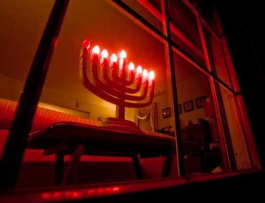 An electric menorah in the window of a Jewish home