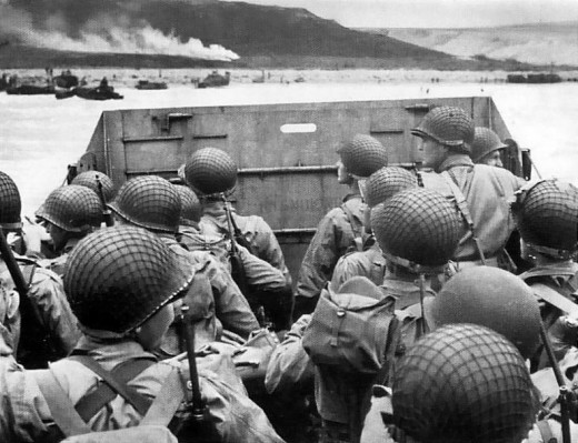 Troops in an LCVP landing craft approaching "Omaha" Beach on "D-Day", 6 June 1944. Note helmet netting; faint "No Smoking" sign on the LCVP's ramp; and M1903 rifles and M1 carbines carried by some of these men.