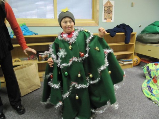 1st PLACE - A BUDDY THE ELF Fan Sharing In His Love For Christmas, Spreading Christmas Cheer As He Is Decorated As A Christmas Tree