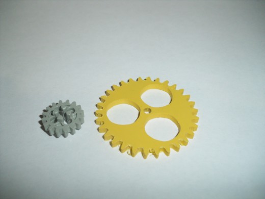 Lego Technics 16 tooth gear versus homemade 30 tooth gear out of PVC sheet (yellow)