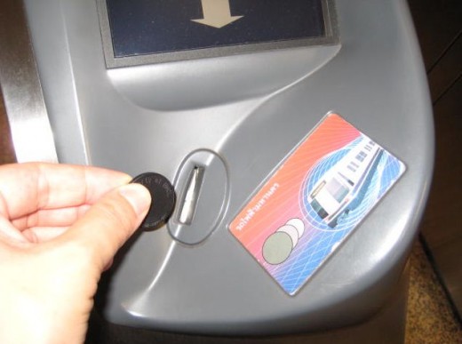 To exit insert the token in the slot or touch the smart pass onto the panel and the gate will open