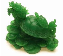 A creature with the body of a tortoise and the head of dragon sitting on a bed of coins and gold ingots
