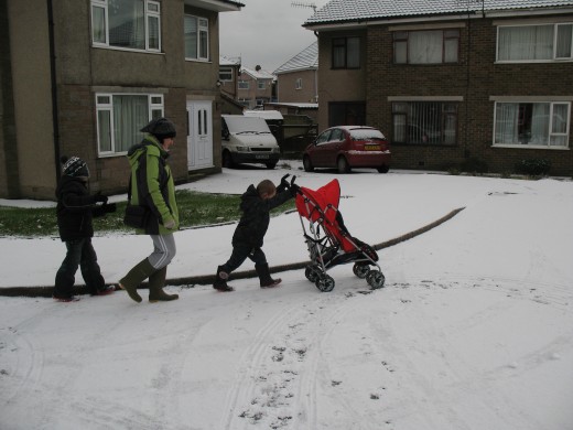 My mum, enjoying the snow with my boys, last year.