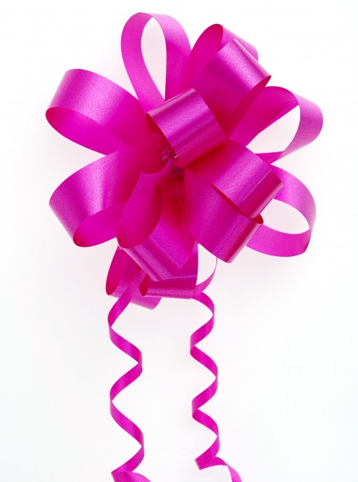 Multi-loop bow with curled ribbon in a monochromatic look.