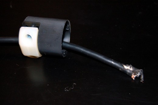 Before doing any wiring, slide the back piece over your wire.  After that's done, cut off any damaged parts of the wire with wire strippers or a sharp knife (be careful). Before doing any wiring, slide the back piece over your wire.  After that's done, cut off any damaged parts of the wire with wire strippers or a sharp knife (be careful).