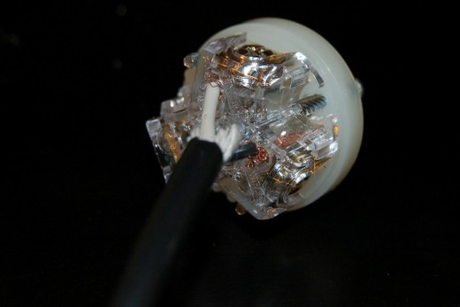 Now strip the individual wires.  Insert the wires into the indicated slots (most modern plugs identify where each color goes).  Tighten the screws down snugly. Now strip the individual wires.  Insert the wires into the indicated slots (most modern plugs identify where each color goes).  Tighten the screws down snugly.