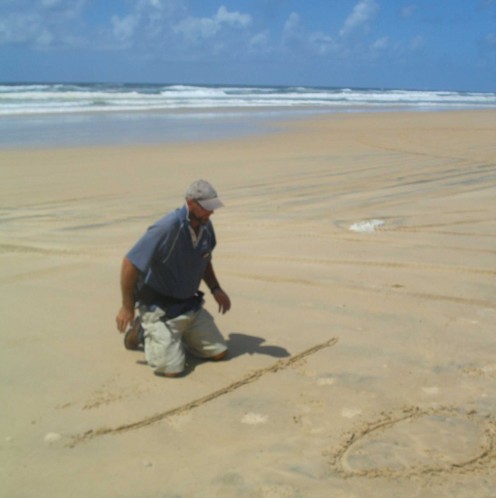 Our guide drawing a map in the sand so we don't get lost.
