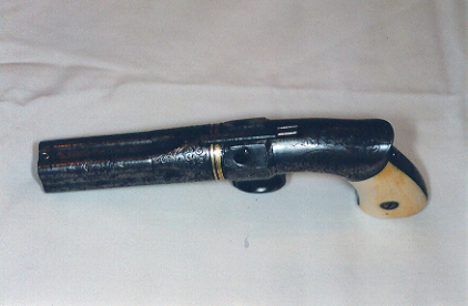 The Revolving hammer pistol.