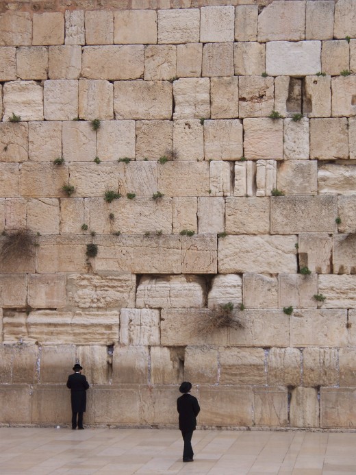 The faithful pray in the shadow of the Western Wall