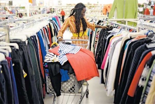 woman shopping for clothes at a thrift store