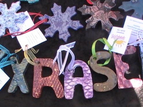 Artists at Inside Out create holiday ornaments and decorative letters.