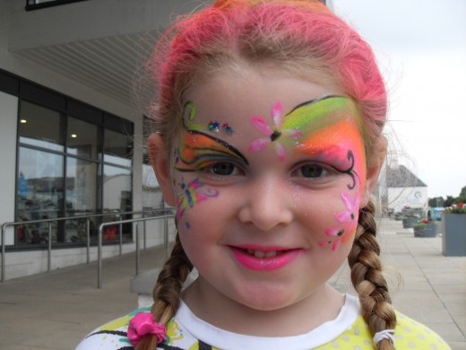 Add a few flowers to a face paint design
