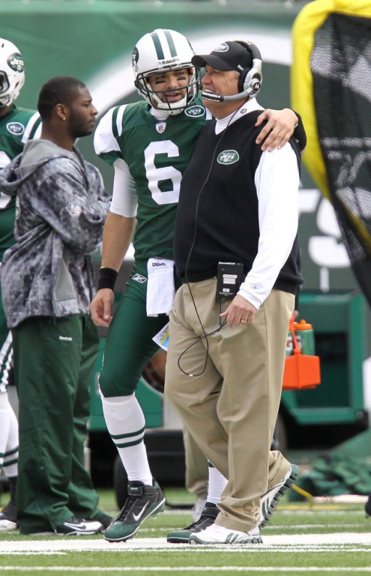 Jets Mark Sanchez puts his arm around coach Rex Ryan and LT in the backround during the first half of the Buffalo Bills vs. the New York Jets at the new Meadowlands Stadium. 1/2/11 John O'Boyle / The Star-Ledger