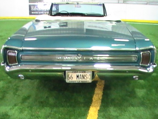 Classics and Chrome Car Show Loves Park Illinois rear photo of teal vintage car 