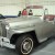 classic silver Jeepster with burgundy interior
