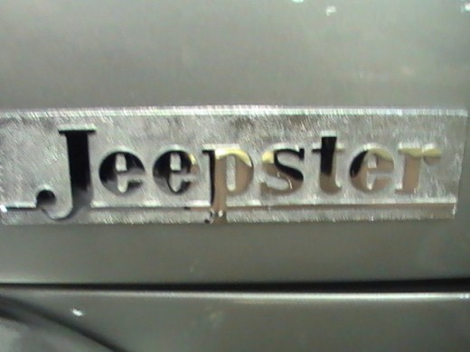 classic silver Jeepster chrome emblem