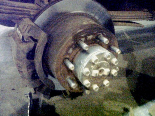 I helped put some new (and badly needed) brake pads on the work truck today.  Would've been fun if the ground hadn't been so cold.