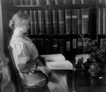 Helen Keller reading by Braille